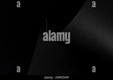 Abstract wave of black paper edge monochrome  background. Geometrical minimalist style backdrop. Copy space. Stock Photo