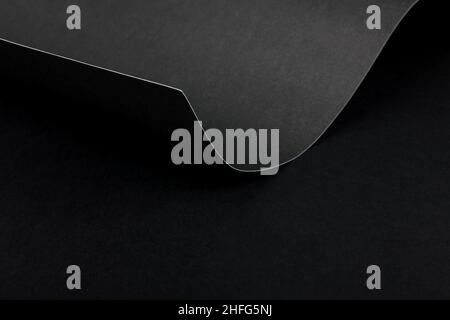 Abstract wave of black paper edge monochrome  background. Geometrical minimalist style backdrop. Copy space. Stock Photo