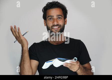 man asking question and showing his bank check book - finance and money concept Stock Photo
