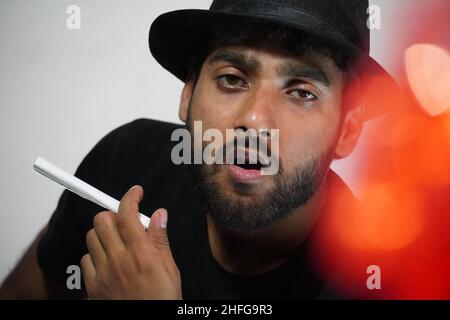 young actor preparing for his act wearing directors cap Stock Photo