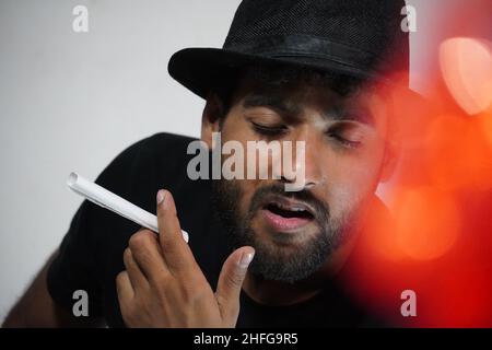 young actor preparing for his act wearing directors cap Stock Photo