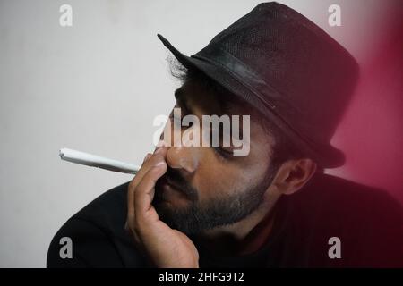 young actor preparing for his act wearing directors cap Stock Photo