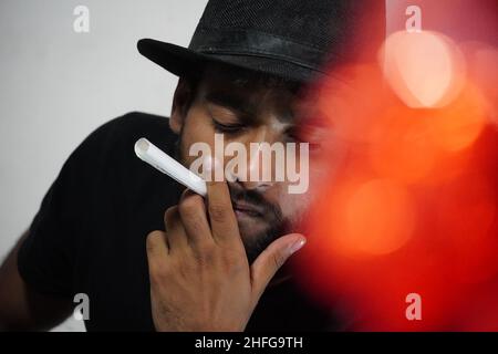 young actor preparing for his act wearing directors cap Stock Photo