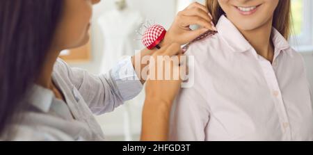 Close up of designer work with client in atelier Stock Photo