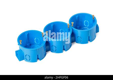 Plastic junction socket boxes for installing sockets and switches in a concrete wall isolated on white Stock Photo