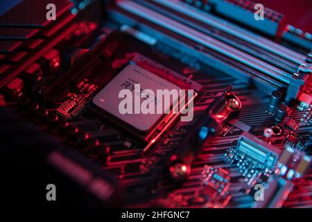 WROCLAW, POLAND - November, 2021: AMD Ryzen 7 3700x Processor close up in the black motherboard CPU socket. Advanced Micro Devices is an American semi Stock Photo