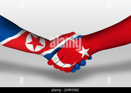 Handshake between turkey and north korea flags painted on hands, illustration with clipping path. Stock Photo