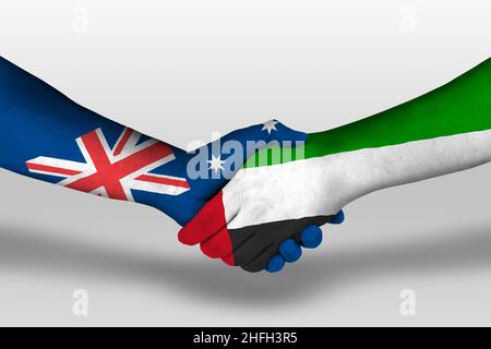 Handshake between united arab emirates and australia flags painted on hands, illustration with clipping path. Stock Photo