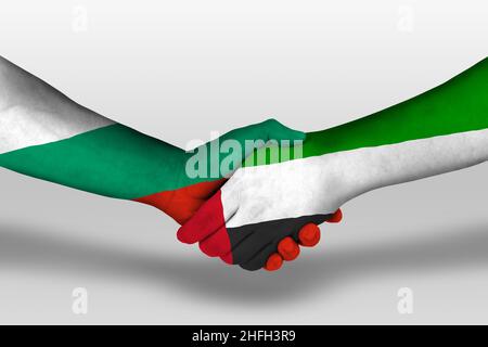 Handshake between united arab emirates and bulgaria flags painted on hands, illustration with clipping path. Stock Photo