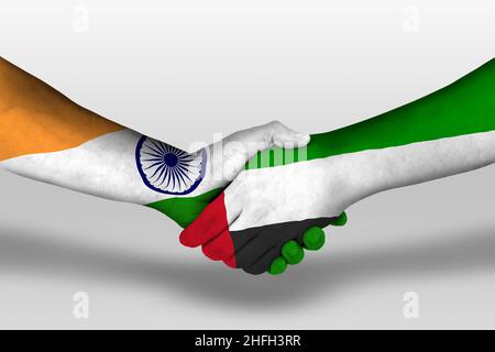 Handshake between united arab emirates and india flags painted on hands, illustration with clipping path. Stock Photo