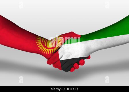 Handshake between united arab emirates and kyrgyzstan flags painted on hands, illustration with clipping path. Stock Photo