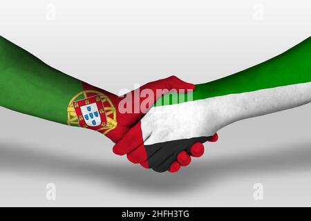 Handshake between united arab emirates and portugal flags painted on hands, illustration with clipping path. Stock Photo
