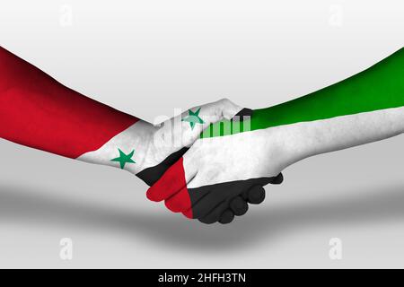 Handshake between united arab emirates and syria flags painted on hands, illustration with clipping path. Stock Photo