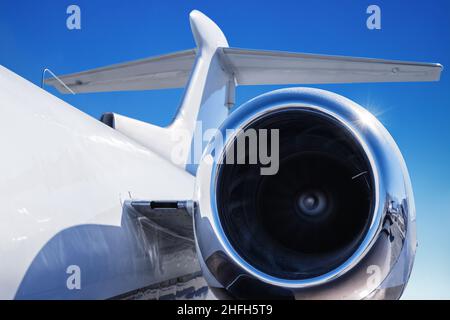 jet engine of an modern airliner against a blue sky Stock Photo