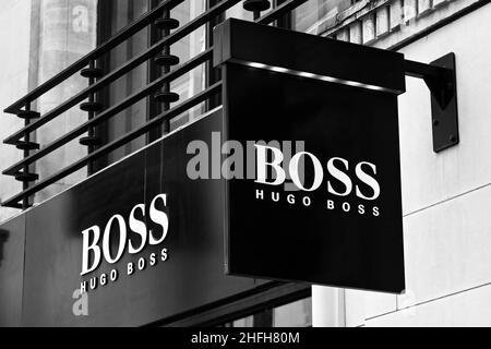 London, England - June 2020: Sign above the entrance to the Hugo Boss designer goods store in New Bond Street. Stock Photo