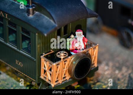 Christmas decorations on toy model train set Stock Photo