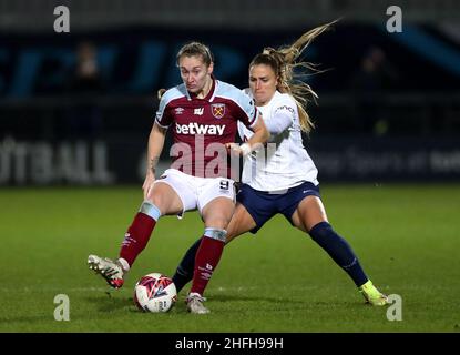 West Ham United's Claudia Walker (left) and Tottenham Hotspur's Shelina Zadorsky battle for the ball during the Barclays FA Women's Super League match at The Hive, Barnet. Picture date: Sunday January 16, 2022. Stock Photo