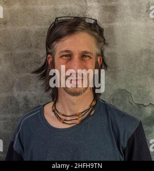 Bearded man portrait near old color stone brick wall Stock Photo