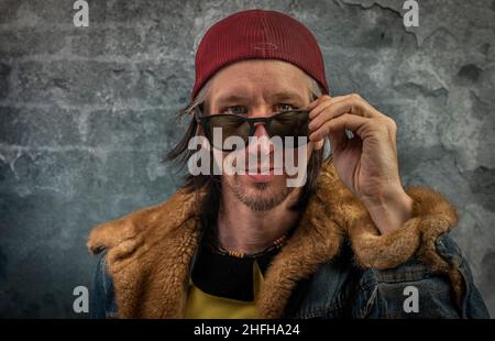 Bearded man portrait near old color stone brick wall Stock Photo