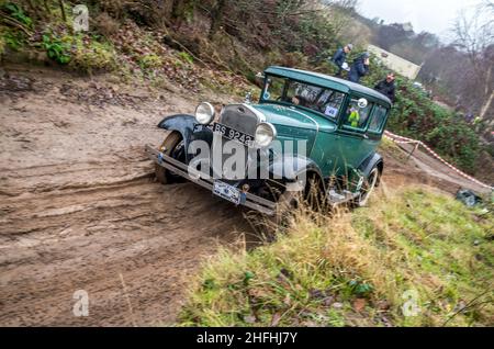 The Vintage model A Ford taking part in the Dave Wilcox Memorial hill trials event in very wet, slippery and muddy conditions. Stock Photo