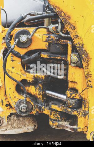 Toned the hydraulic system, high-pressure rubber hoses, shaft power systems unit construction bulldozer, excavator, loader Stock Photo