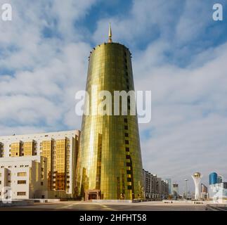 One of the Golden Towers, futuristic modern gold reflective buildings at the entrance to the Presidential Palace in Astana, capital city of Kazakhstan Stock Photo