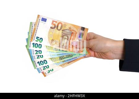 Woman hand holding euro cash money isolated on white background. Stock Photo