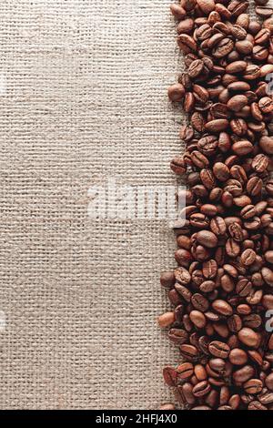 Coffee beans on burlap background Stock Photo