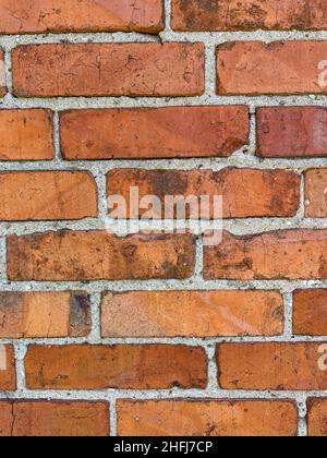 Brickwork is masonry produced by a bricklayer, using bricks and mortar. Typically, rows of bricks called courses are laid on top of one another to bui Stock Photo