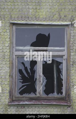 Broken window in roof Stock Photo