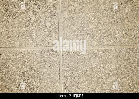 External finishing of concrete wall imitating ceramic tile, textured background. Stock Photo