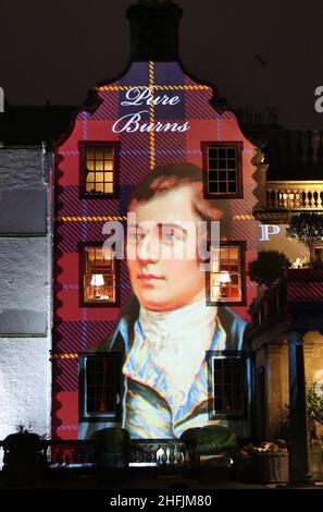 File photo dated 25/01/18 of a portrait of Robert Burns projected on to the front of Prestonfield House in Edinburgh during Burns Night. Burns was advised not to write in Scots by a correspondent who thought it would limit his audience, according to new research. A project by academics at the University of Glasgow's Centre for Robert Burns Studies looked at letters to and from Scotland's national bard. Issue date: Monday January 17, 2022. Stock Photo