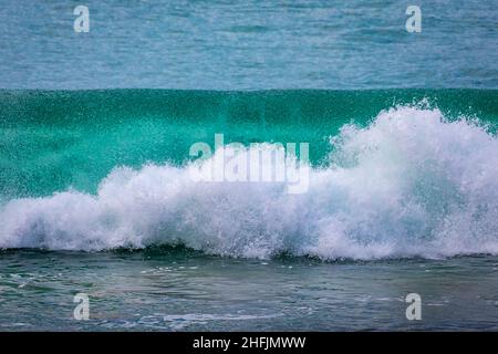Powerful Pacific Ocean wave breaking by the beach in San Clemente, Southern California, Orange County Stock Photo