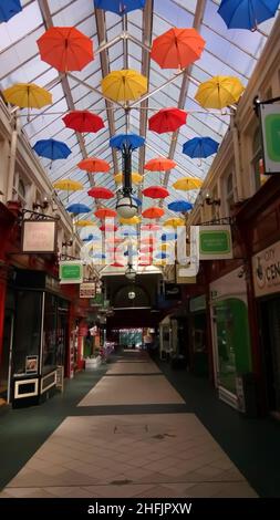 Makinson Arcade interior, elaborate Victorian Arcade with colourful open umbrellas covering the ceiling.  Wigan, UK, 06-06-2018 Stock Photo