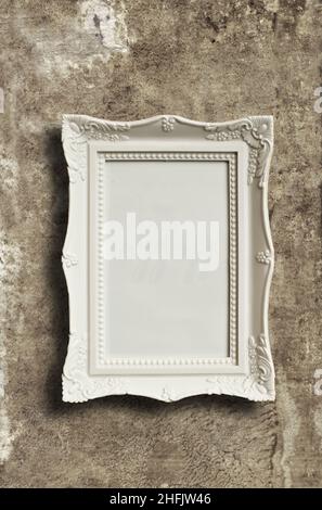 white blank picture frame on grunge wall Stock Photo