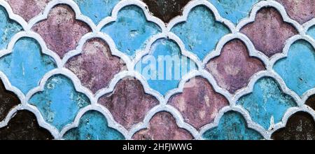 Ancient floral oriental ornament of ceramic tiles. Fragment of the wall Stock Photo