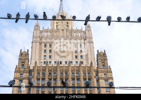 Dove of peace. Doves sit on wires in front of the building of the Ministry of Foreign Affairs. Stock Photo