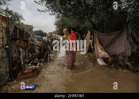 Gaza City. 17th January 2022. A Palestinian family woke up in the morning to the torrential rain that stormed their home while they were sleeping following torrential rains that hit the Beit Lahia in the northern Gaza strip. Gaza. Credit: Majority World CIC/Alamy Live News Stock Photo