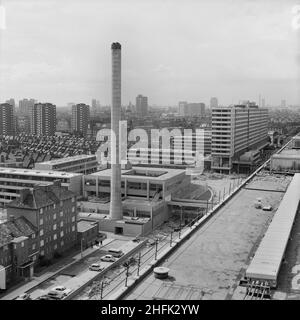 Aylesbury Estate, Walworth, Southwark, London, 29/06/1970. Looking north-west over the Aylesbury Estate, showing the 'Centre Building' with its 170ft chimney and Taplow House, a 14-storey block of flats on the right. Laing's Southern Region started building the Aylesbury Estate in 1967. At the time it was the largest industrialised housing scheme ever undertaken by a London Borough, providing homes for more than 7000 people, comprising of low and high-rise linear blocks from four to fourteen-storeys high containing flats and maisonettes, built using the 12M Jespersen system. The 'Centre Buildi Stock Photo