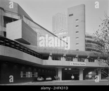 Barbican Centre, Silk Street, City of London, 01/03/1982. An exterior view of the main entrance to the Barbican Arts Centre. John Laing &amp; Son Ltd were responsible for the construction of Phase V of the Barbican development, which included the Barbican Arts Centre and the Guildhall School of Music and Drama. The Barbican Centre is a huge performing arts centre which houses a library, theatre, concert hall, cinemas, conservatory, seminar rooms and more. On Wednesday 3rd March 1982, the Barbican Centre was ceremonially opened by Queen Elizabeth II, who unveiled a commemorative plaque to mark Stock Photo