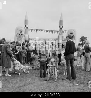 Laing Sports Ground, Rowley Lane, Elstree, Barnet, London, 16/06/1979. A crowd of people gathered around a bouncy castle at the annual Laing Gala Day. Stock Photo