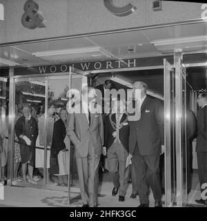 Bull Ring Centre, Birmingham, 29/05/1964. HRH Prince Philip exiting the new Woolworth's store at the Bull Ring Centre on the day of the opening ceremony. On 29th May 1964, His Royal Highness Prince Philip, Duke of Edinburgh, opened the Bull Ring Centre. The Duke toured the site, meeting various people along the way and unveiling a commemorative plaque in the Centre Court. A formal lunch was then held in his honour at the Mecca Banqueting Hall; part of the new Bull Ring development. Approximately 400 guests attended including the Lord Mayor of Birmingham; Alderman F Price (seen in this image), Stock Photo