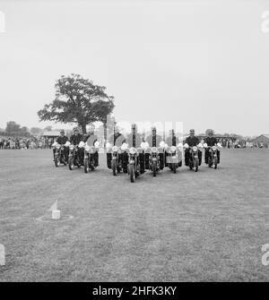 Laing Sports Ground, Rowley Lane, Elstree, Barnet, London, 17/06/1961. The Metropolitan Police Motorcycle Precision Ride Team putting on a demonstration at a Laing sports day at Elstree. This image was published in July 1961 in Laing's monthly newsletter 'Team Spirit'. Stock Photo