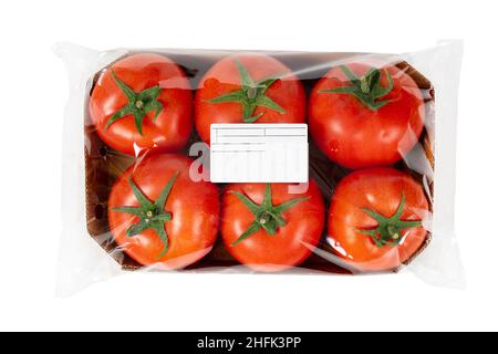 Packed and labeled fresh tomatoes on isolated white background Stock Photo