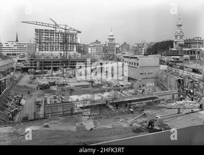 Paternoster Square, City of London, 03/09/1962. Looking west over the Paternoster development during its construction, showing the Old Bailey in the background and Christchurch Greyfriars on the right. Work on the Paternoster development was carried out in a joint venture by John Laing Construction Limited, Trollope and Colls Limited, and George Wimpey and Company Limited. The scheme involved the redevelopment of a seven acre site on the north side of St Paul&#x2019;s Cathedral. The site had been almost entirely devastated during an incendiary raid in December 1940. The development consisted o Stock Photo