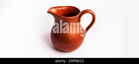 clay jug for milk on a white background Stock Photo