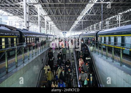 (220117) -- GUIYANG, Jan. 17, 2022 (Xinhua) -- Passengers get off the trains at Guiyang Railway Station in Guiyang, southwest China's Guizhou Province, Jan. 17, 2022. The number of railway passenger trips during China's upcoming Spring Festival travel rush is expected to jump 28.5 percent from the holiday season last year, industry data shows. The 2022 Spring Festival travel rush will last from Jan. 17 to Feb. 25. During the 40-day travel season, also known as chunyun, many Chinese people will travel to meet their families for the Chinese Lunar New Year, or Spring Festival, which will fal Stock Photo