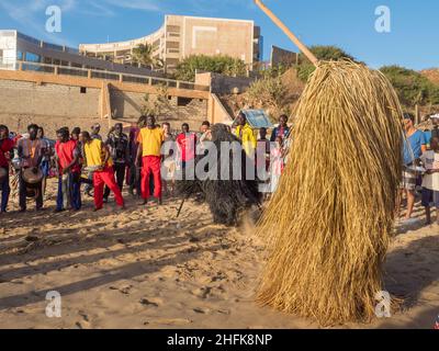 Dakar, Senegal - Feb, 2019: The Kumpo dance on the beach in Dakar. The Kumpo,  Samay, and the Niasse are three traditional figures in the mythology of Stock Photo