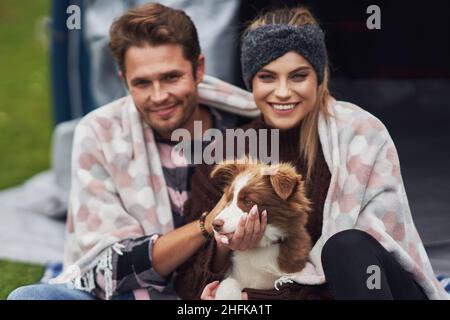 Young nice couple having fun on camping Stock Photo