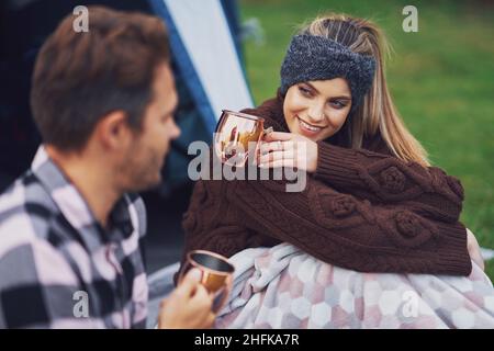 Young nice couple having fun on camping Stock Photo